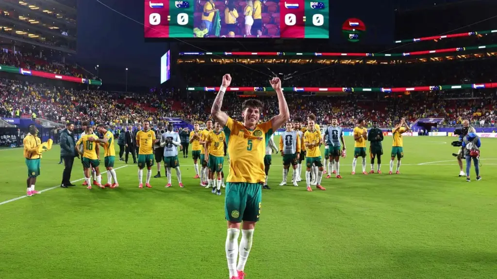 Socceroos secure place in World Cup last 32 after nerve-shredding draw with Paraguay