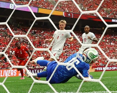 Johan Manzambi squeezes the ball past Canada's keeper Maxime Crepeau to double Switzerland’s lead.