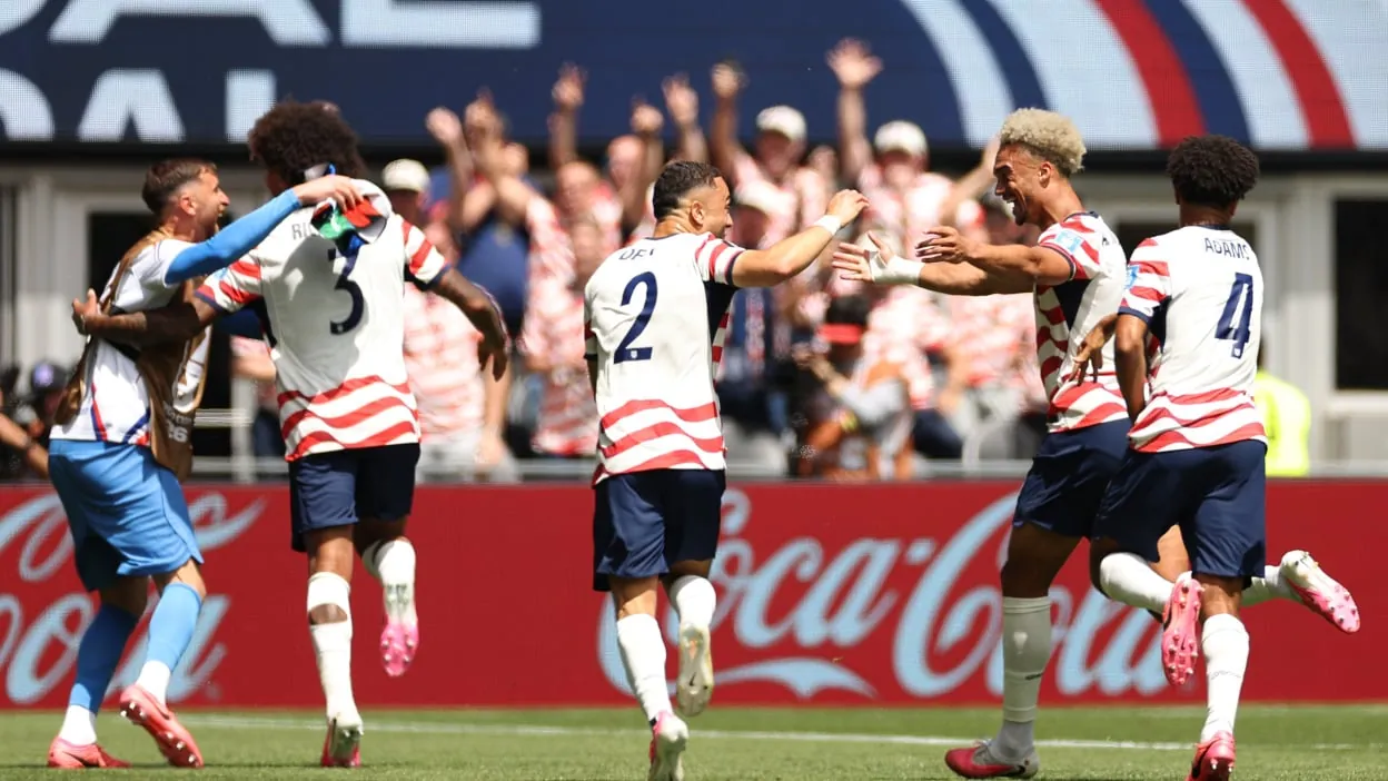 The USA soccer team celebrate a goal at the World Cup
