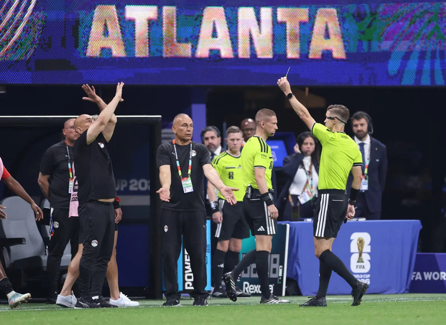 Hossam Hassan Manager / Head Coach of Egypt is shown a yellow card during the FIFA World Cup 2026 Round of 16 match between Argentina and Egypt at Atlanta Stadium on July 07, 2026 in Atlanta, Georgia.